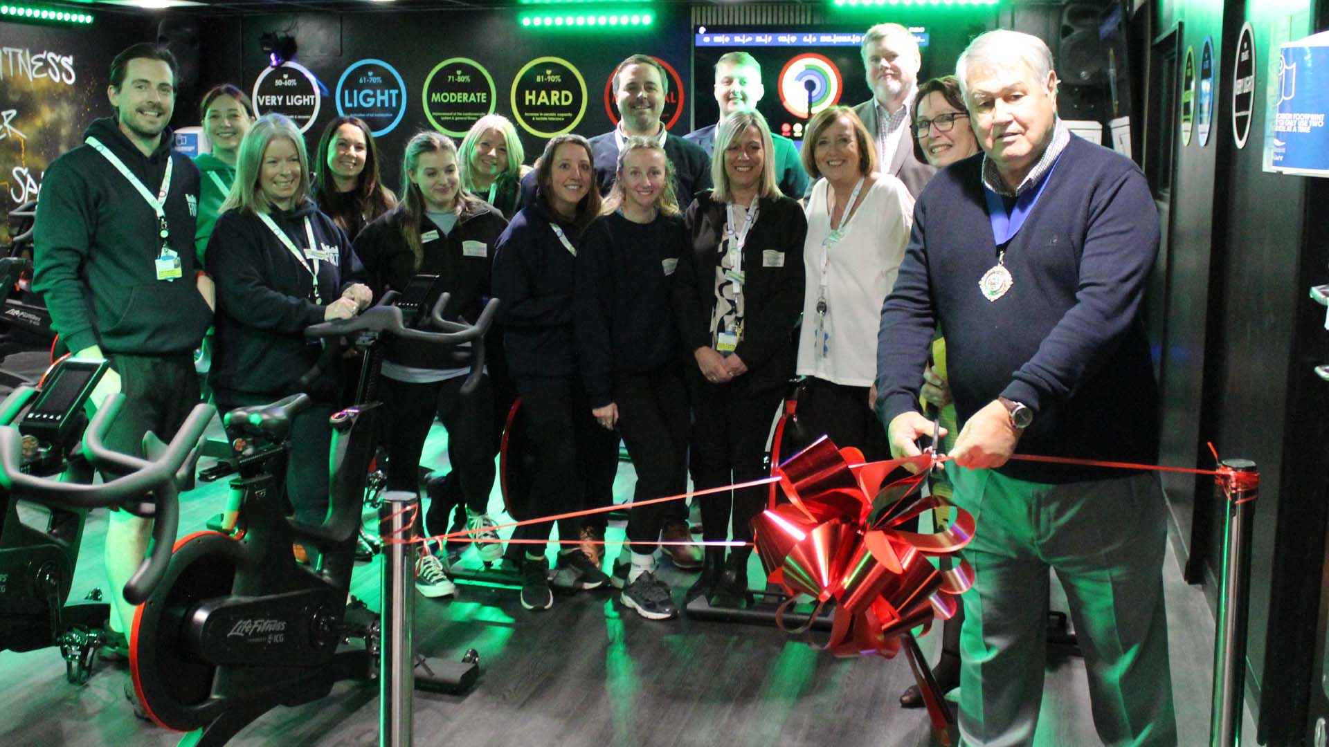 cutting-ribbon-at-grand-opening-of-new-spin-room